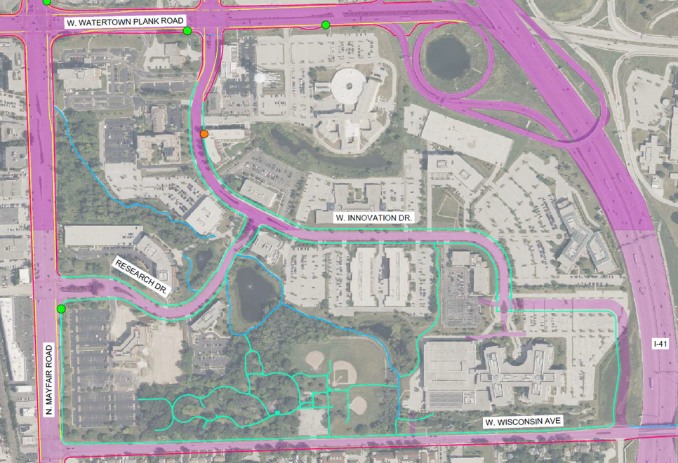 An aerial view of some of the possible concepts in the area, including pickleball courts and a small performance stage